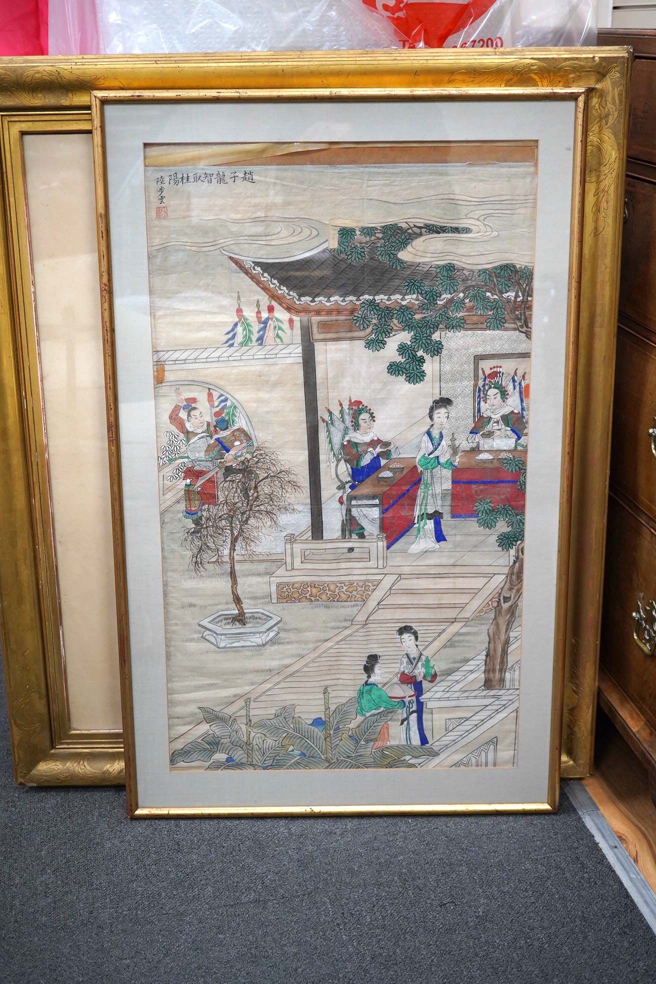 Chinese School, watercolour on silk, Attendants and figures beneath a pagoda, signed with character marks and with seal mark, 80 x 45cm. Condition - poor